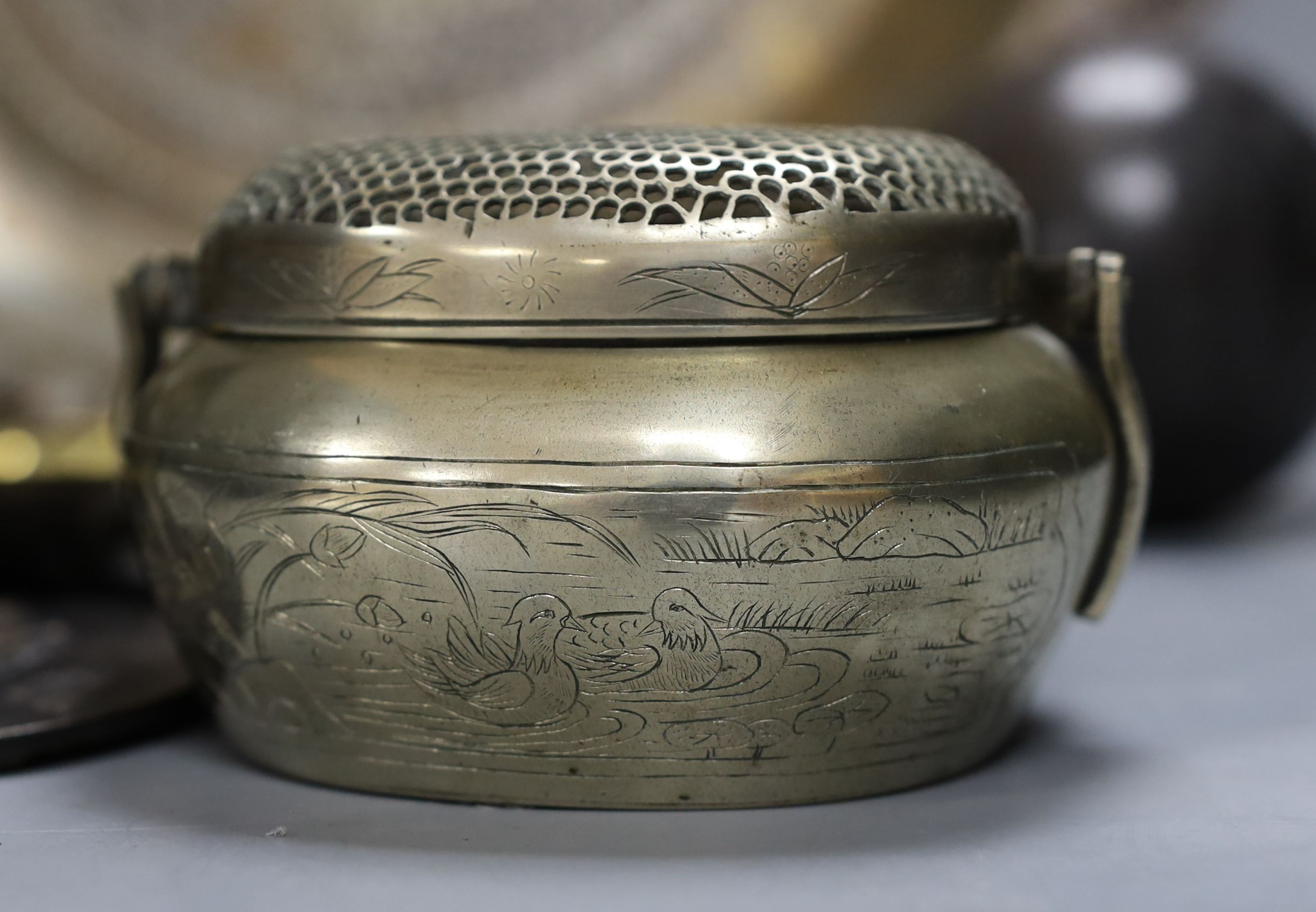 Metalware to include - a Sino-Tibetan bronze amulet, a Bidri ware dish, a Chinese paktong handwarmer Asian wood balls with inset coins etc